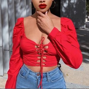 Red long-sleeve lace up crop top